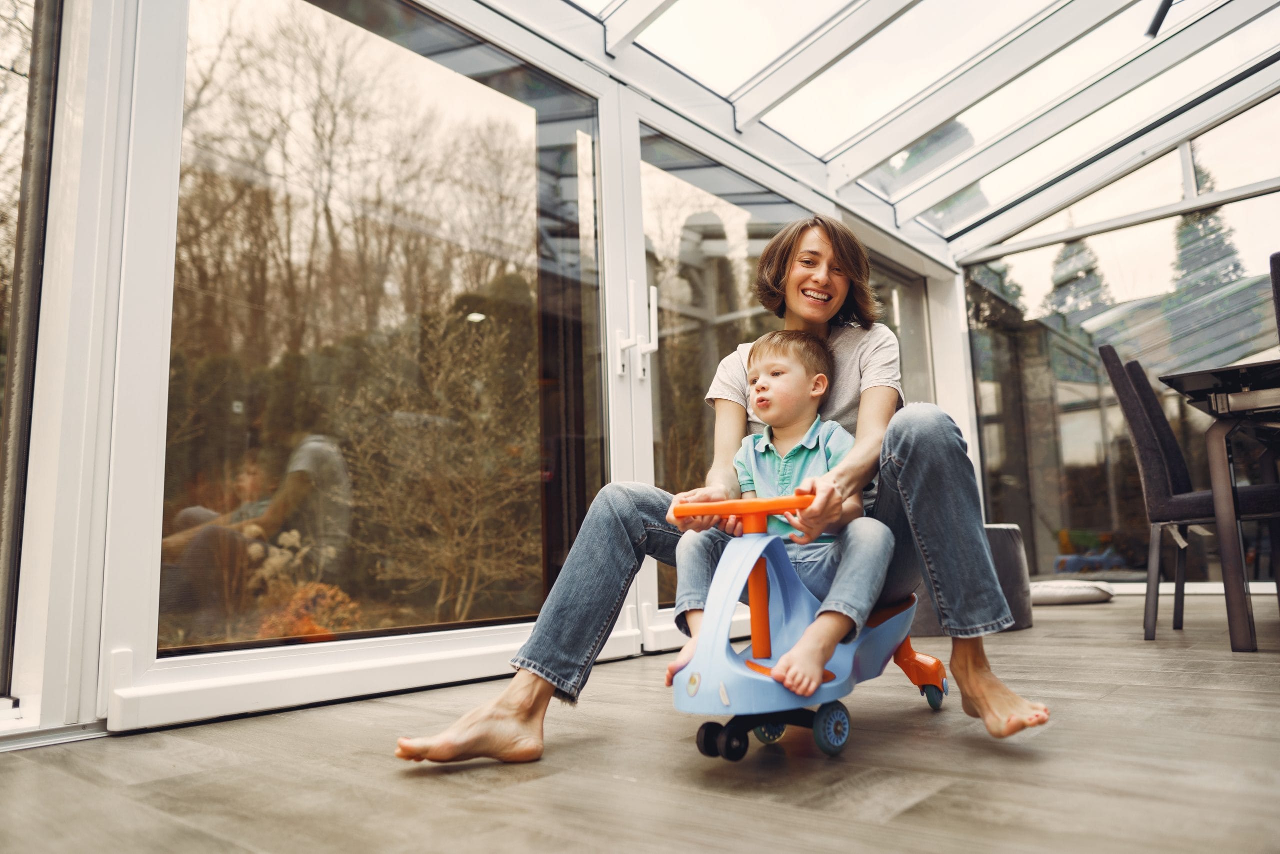 mother-son-go-around-apartment-toy-car